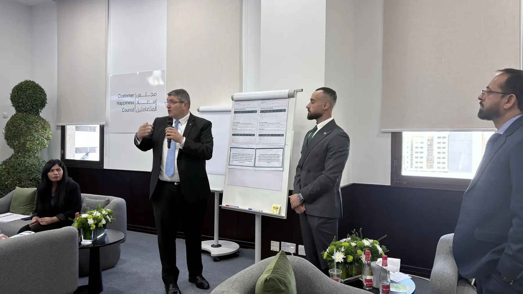 Participants presenting collaborative stakeholder solutions during a Dubai Land Department workshop