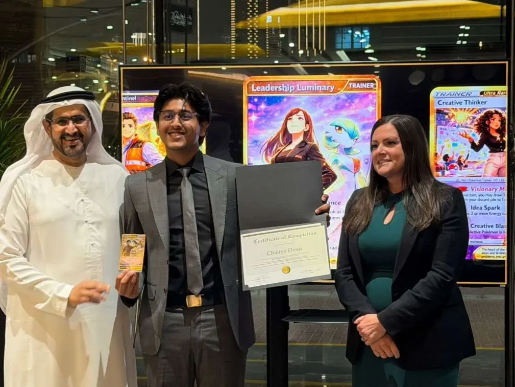 A student receiving recognition at the GEMS WSO programme graduation